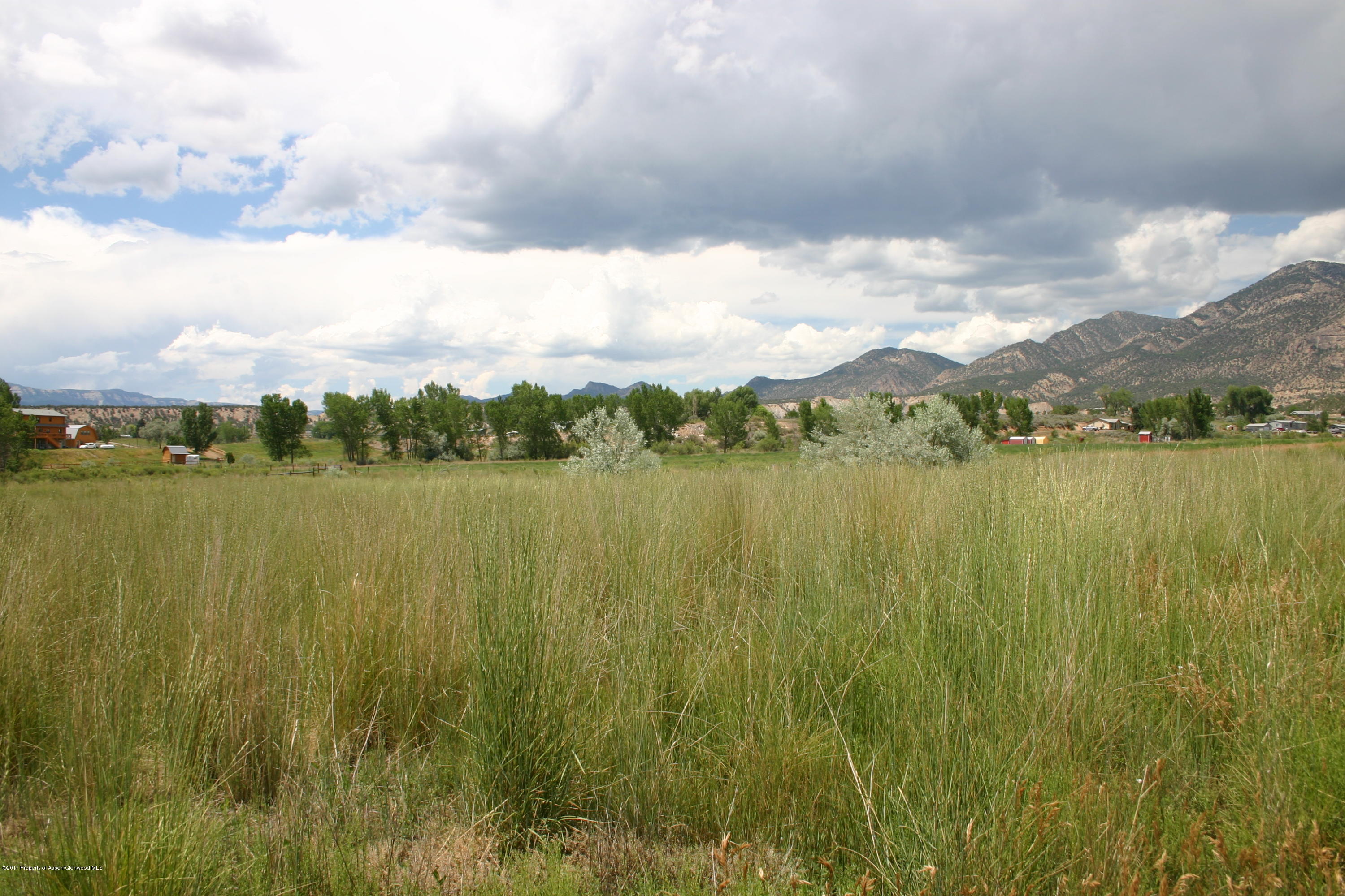27 County Road 259 Rifle, CO 81650 - Photo 6 of 7 a view of a lake with houses in the back