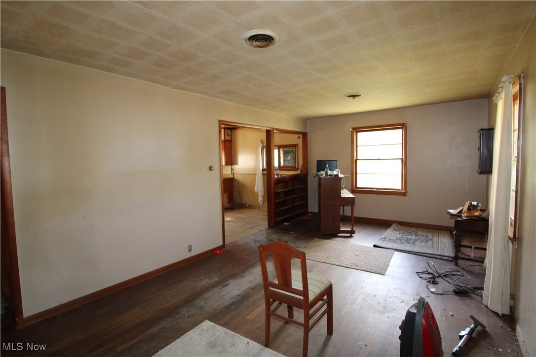 5084 West Fremont Road Port Clinton, OH 43452 - Photo 14 of 19 Bedroom featuring wood finished floors and baseboards