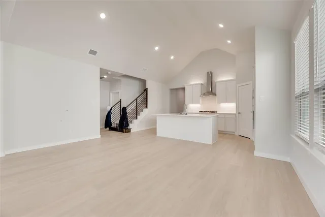 a view of a kitchen with a sink and a window