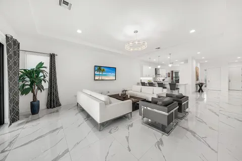 a large bathroom with a granite countertop double vanity sink a mirror and a shower