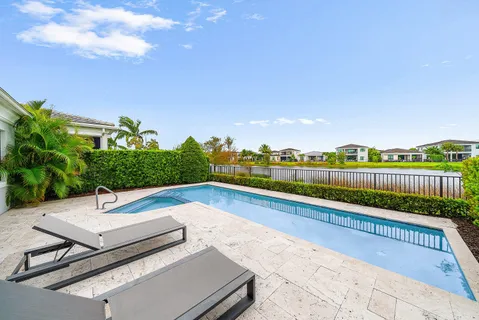 a view of a lake with houses in the back