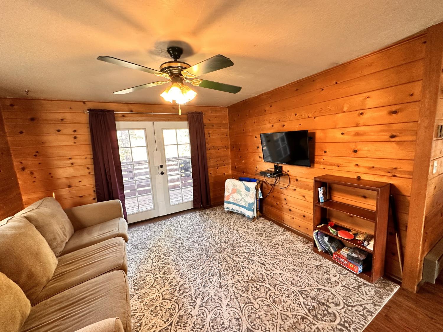 34065 Shaver Springs Road Auberry, CA 93602 - Photo 4 of 13 a living room with furniture and a flat screen tv