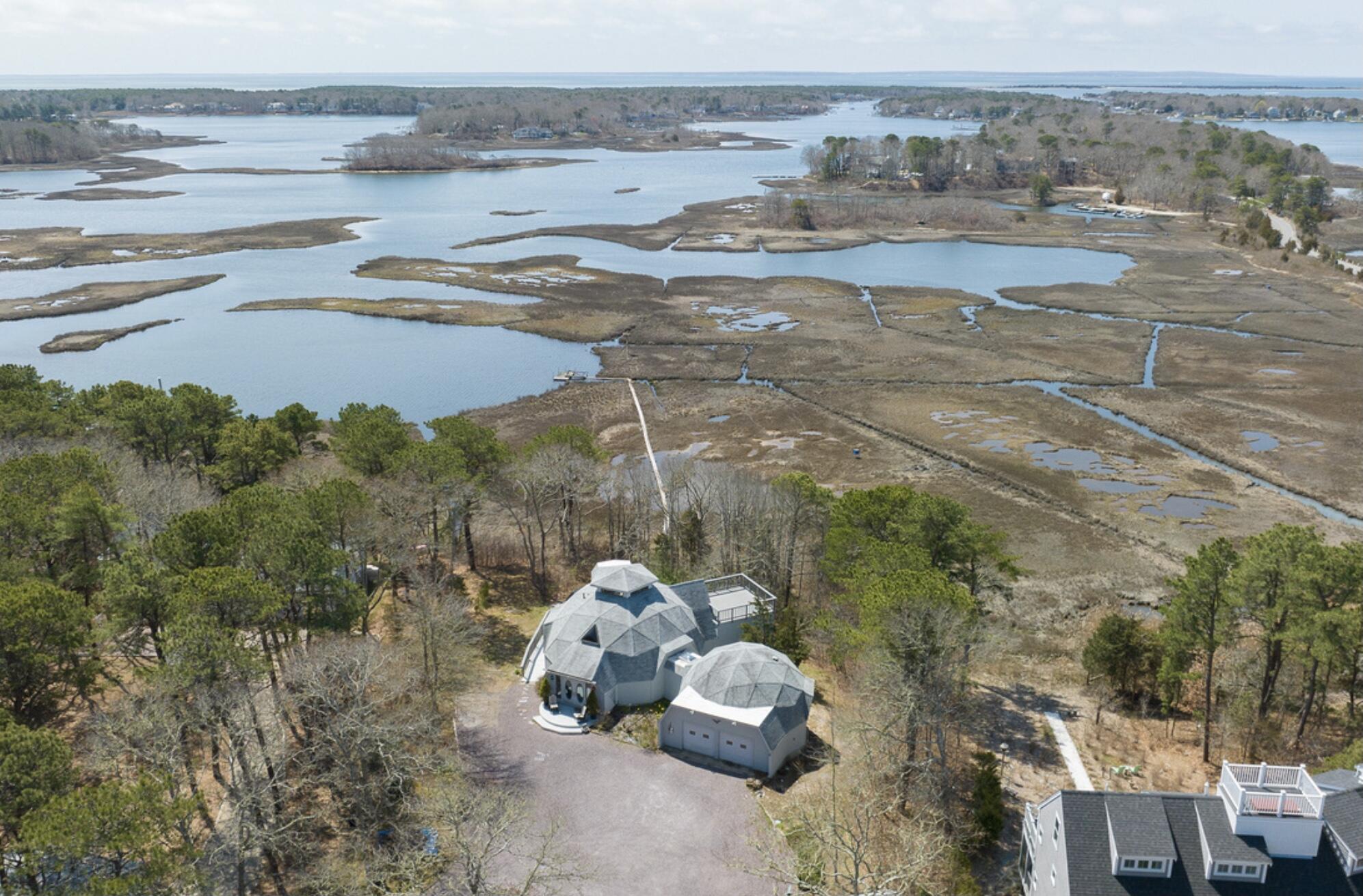 37 Amy Brown Road Mashpee, MA 02649 - Photo 1 of 59 a view of a lake with a mountain