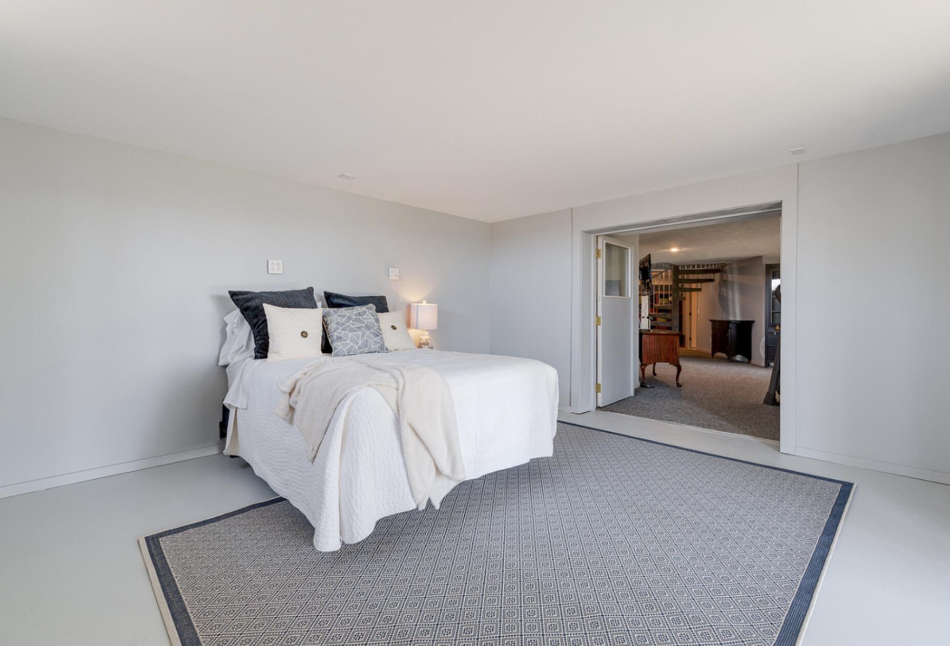 37 Amy Brown Road Mashpee, MA 02649 - Photo 50 of 59 a bedroom with a bed and lamp