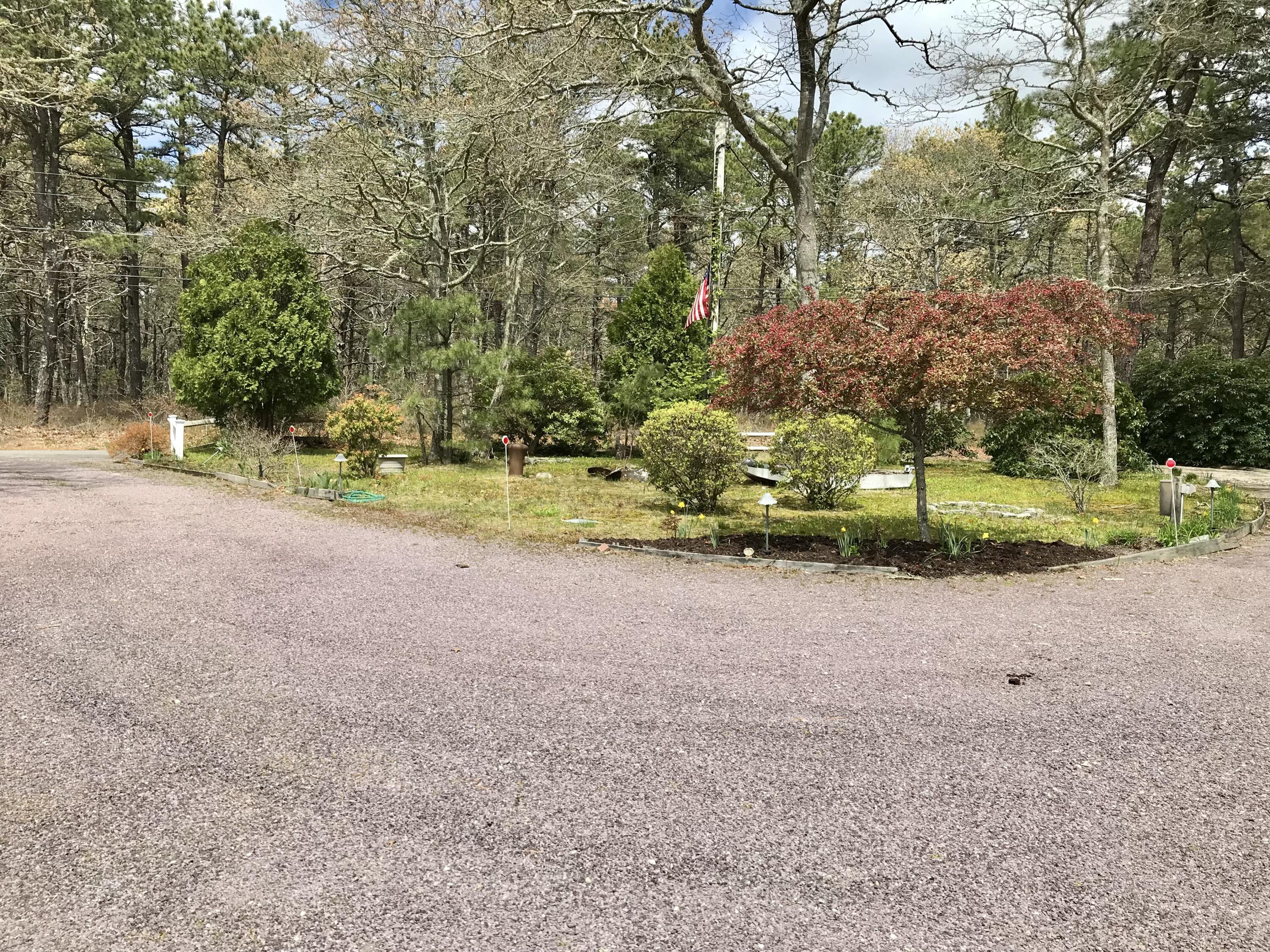 37 Amy Brown Road Mashpee, MA 02649 - Photo 54 of 59 a view of a yard with plants and trees