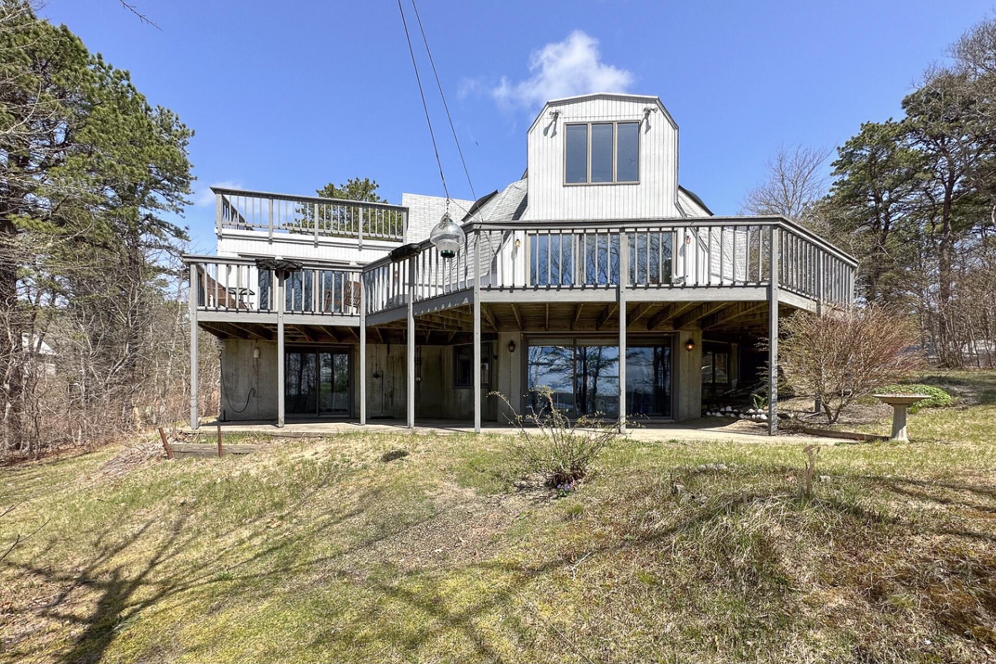 37 Amy Brown Road Mashpee, MA 02649 - Photo 8 of 59 a front view of a building with a garden