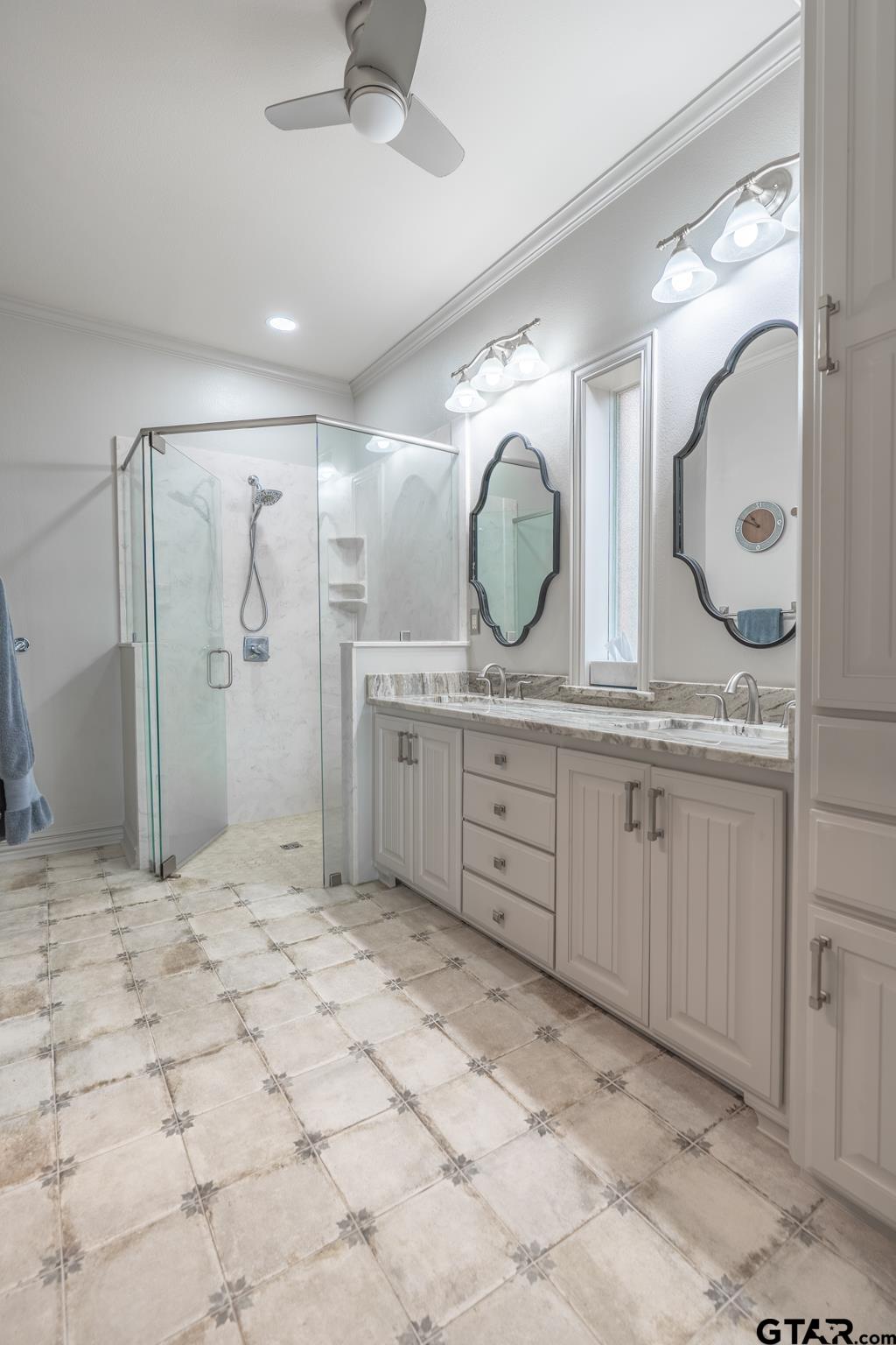 16142 Treasure Cove Bullard, TX 75757 - Photo 23 of 48 a large bathroom with a granite countertop sink mirror and shower
