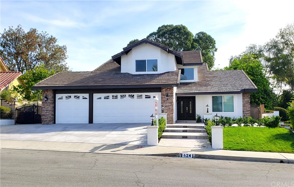 624 North Rocking Horse Road Walnut, CA 91789 - Photo 1 of 1 FRONT is beautiful. Notice left gate for RV Access, built-in lighting on stairs and great color combination.