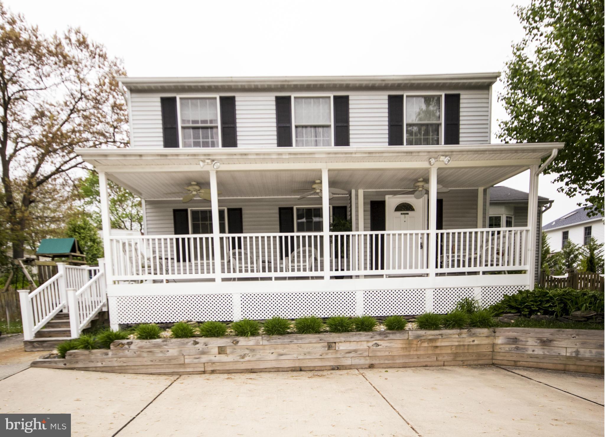 9336 Ramblebrook Road Baltimore, MD 21236 - Photo 1 of 30 front of a house with a street