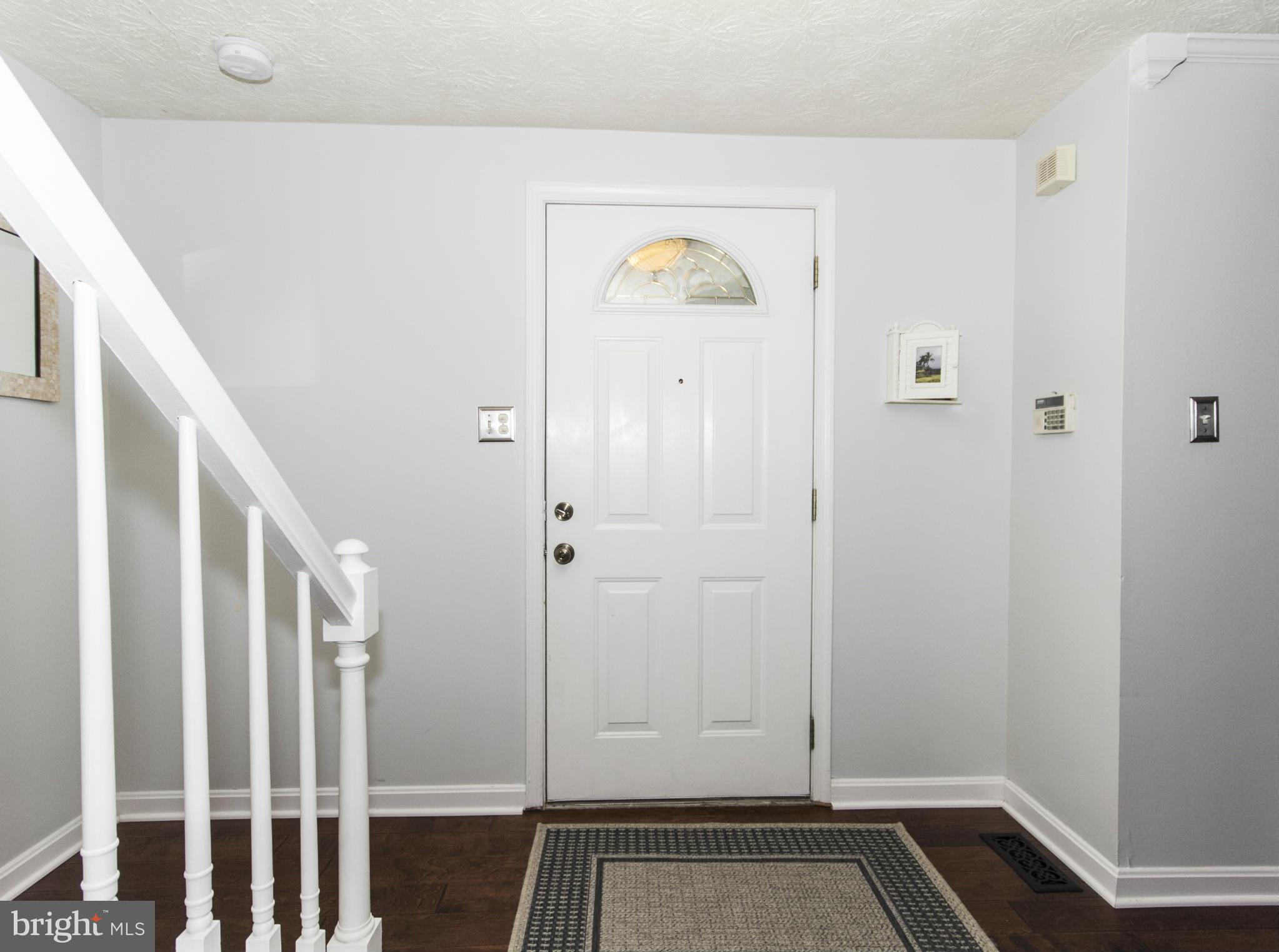 9336 Ramblebrook Road Baltimore, MD 21236 - Photo 3 of 30 a view of an entryway with wooden floor