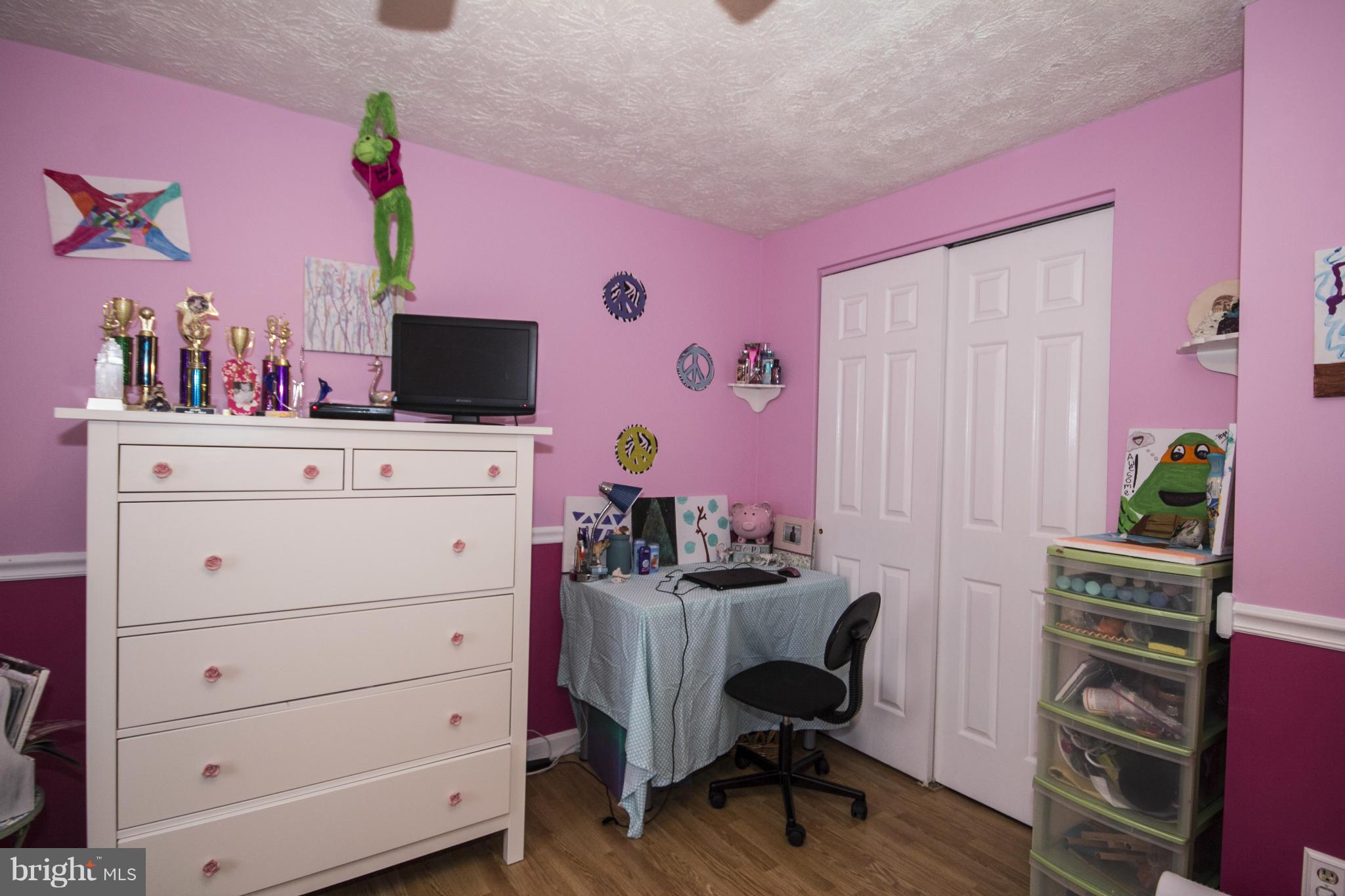 9336 Ramblebrook Road Baltimore, MD 21236 - Photo 22 of 30 a view of a workspace with furniture and a potted plant