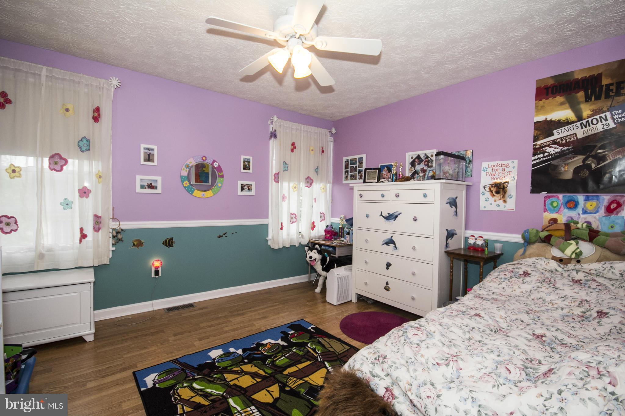 9336 Ramblebrook Road Baltimore, MD 21236 - Photo 23 of 30 a bedroom with a bed and a dresser