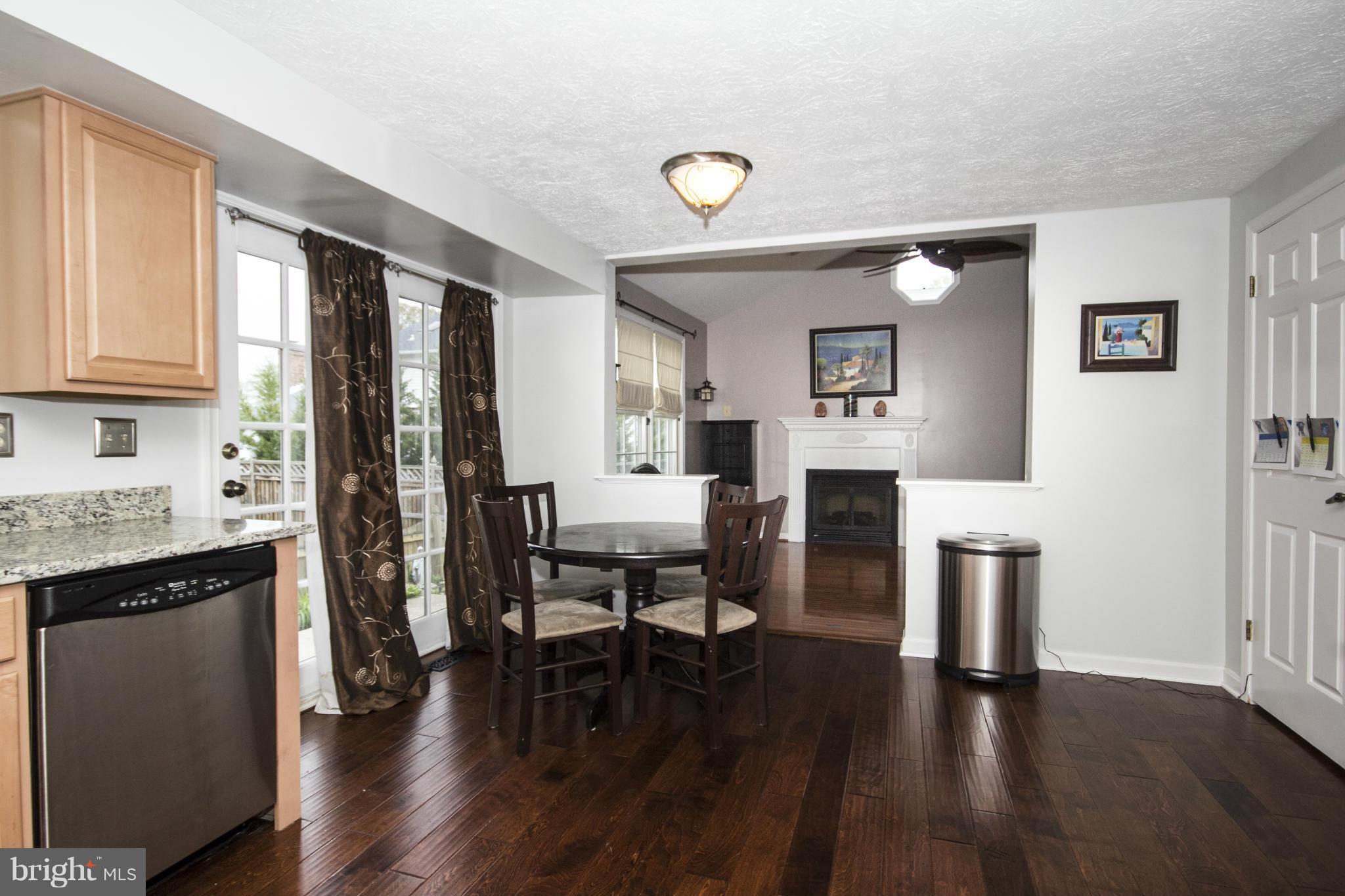 9336 Ramblebrook Road Baltimore, MD 21236 - Photo 8 of 30 a living room with furniture and a wooden floor