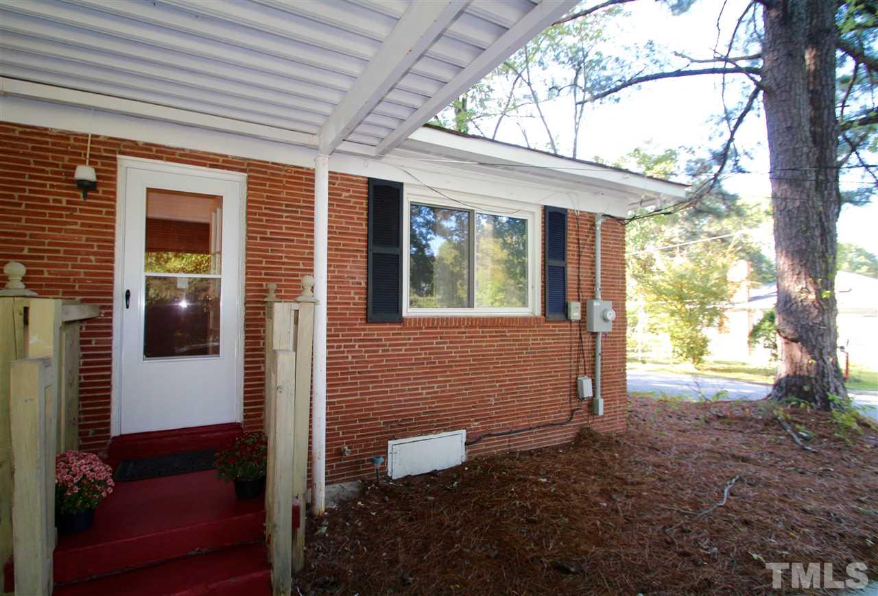 1414 West Garner Road Garner, NC 27529 - Photo 3 of 16 a front view of a house with a yard