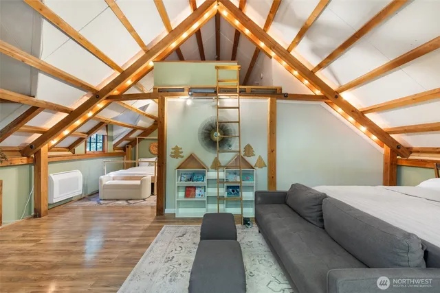 a bedroom with a bed and a large window