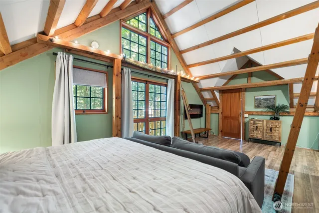 a bathroom with a granite countertop sink and a large mirror