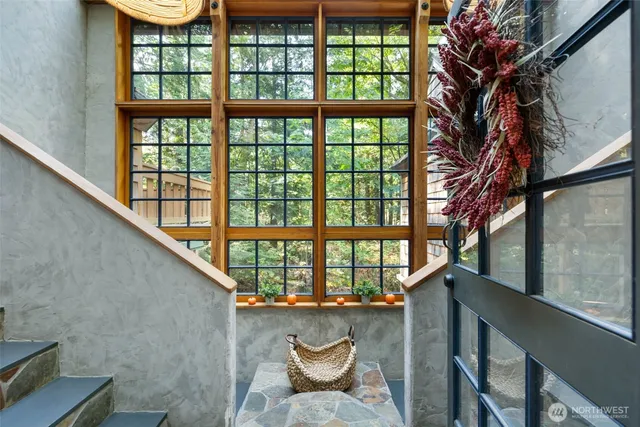 a front view of a house with outdoor seating