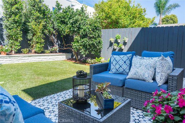a view of a backyard with furniture
