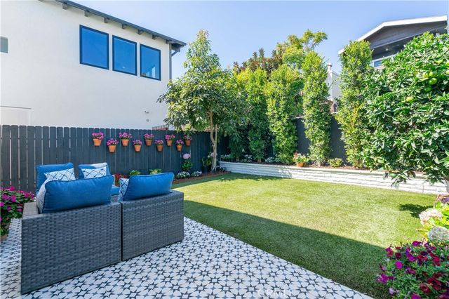a view of a chairs and tables in the backyard