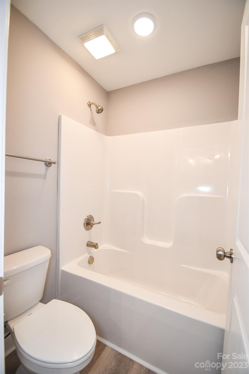 1620 McIntyre Road, Unit 8 Wingate, NC 28174 - Photo 23 of 31 a bathroom with a toilet and a bathtub