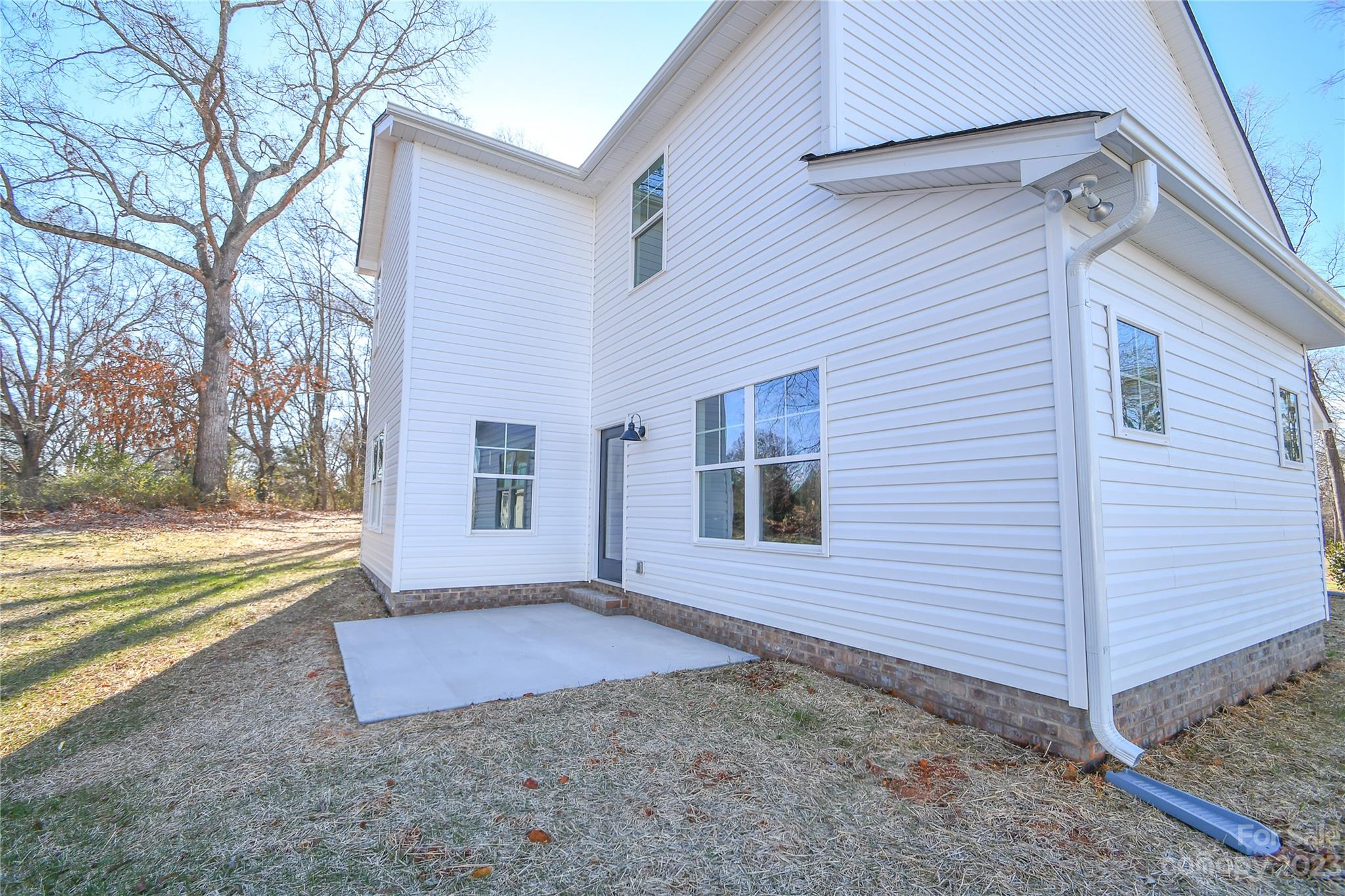 1620 McIntyre Road, Unit 8 Wingate, NC 28174 - Photo 3 of 31 a view of a house with a yard and potted plants