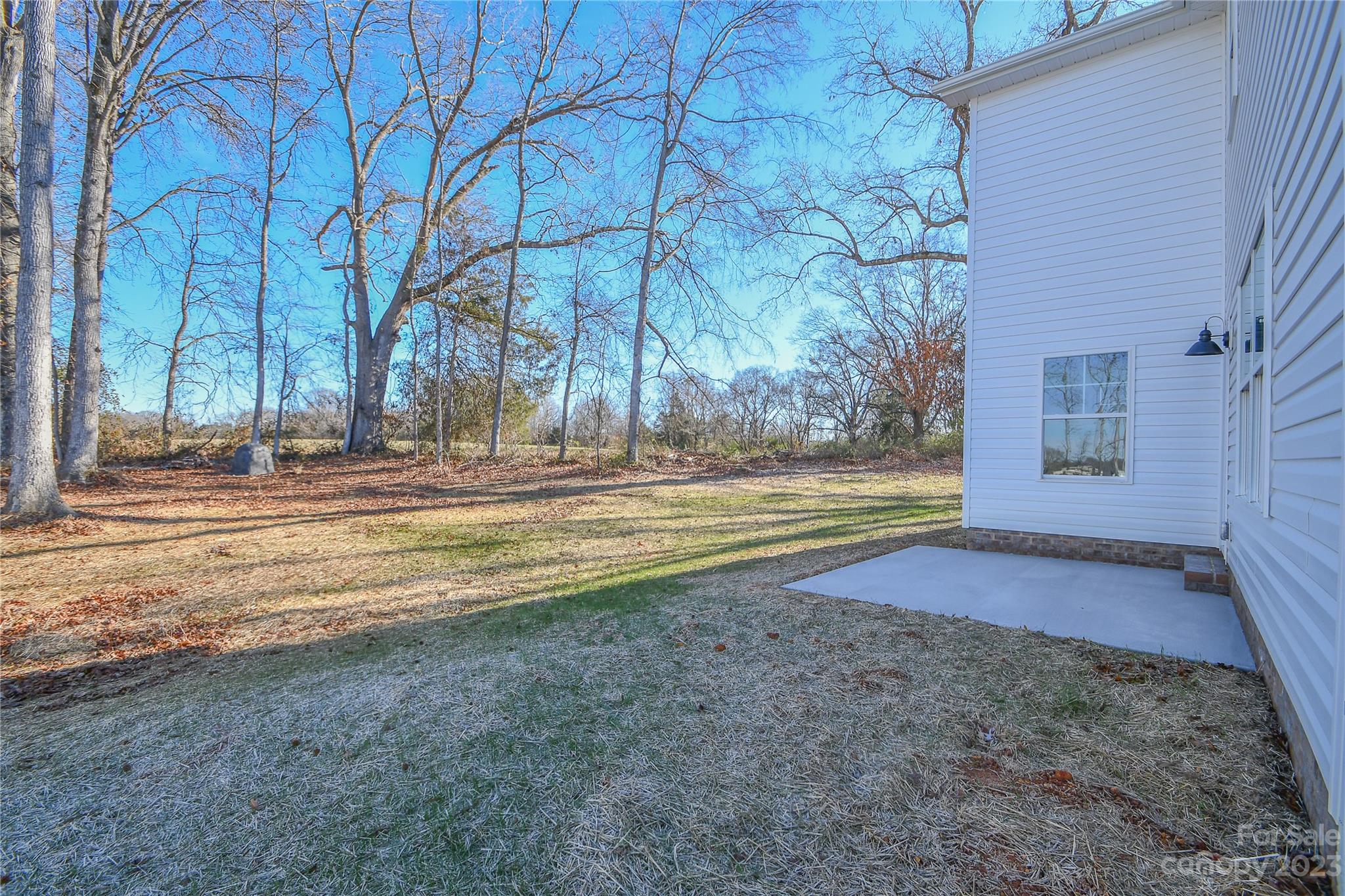 1620 McIntyre Road, Unit 8 Wingate, NC 28174 - Photo 4 of 31 a view of a house with a yard