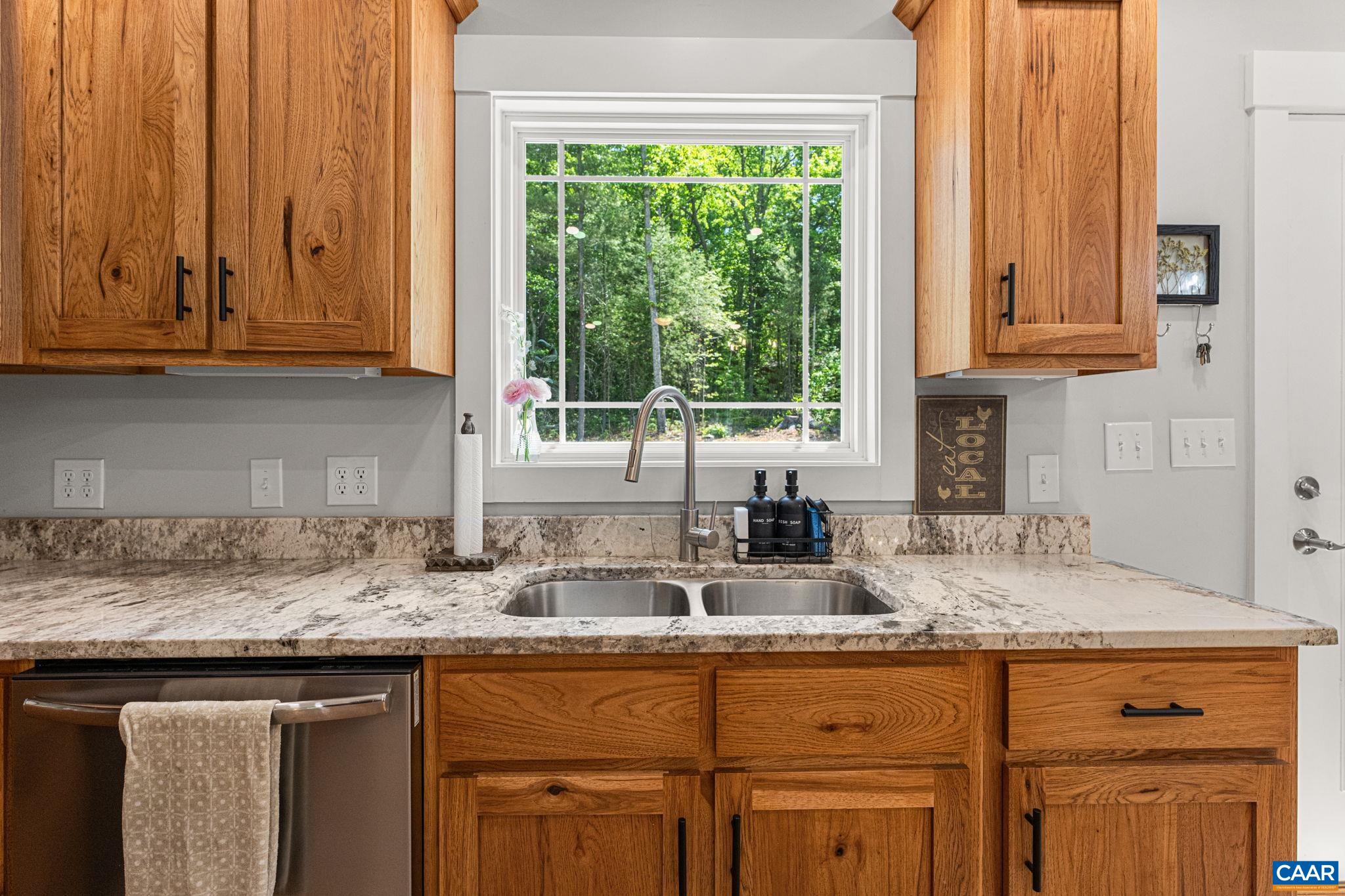 230 Fox Hollow Road Ruckersville, VA 22968 - Photo 14 of 42 a kitchen with granite countertop stainless steel appliances window and cabinets