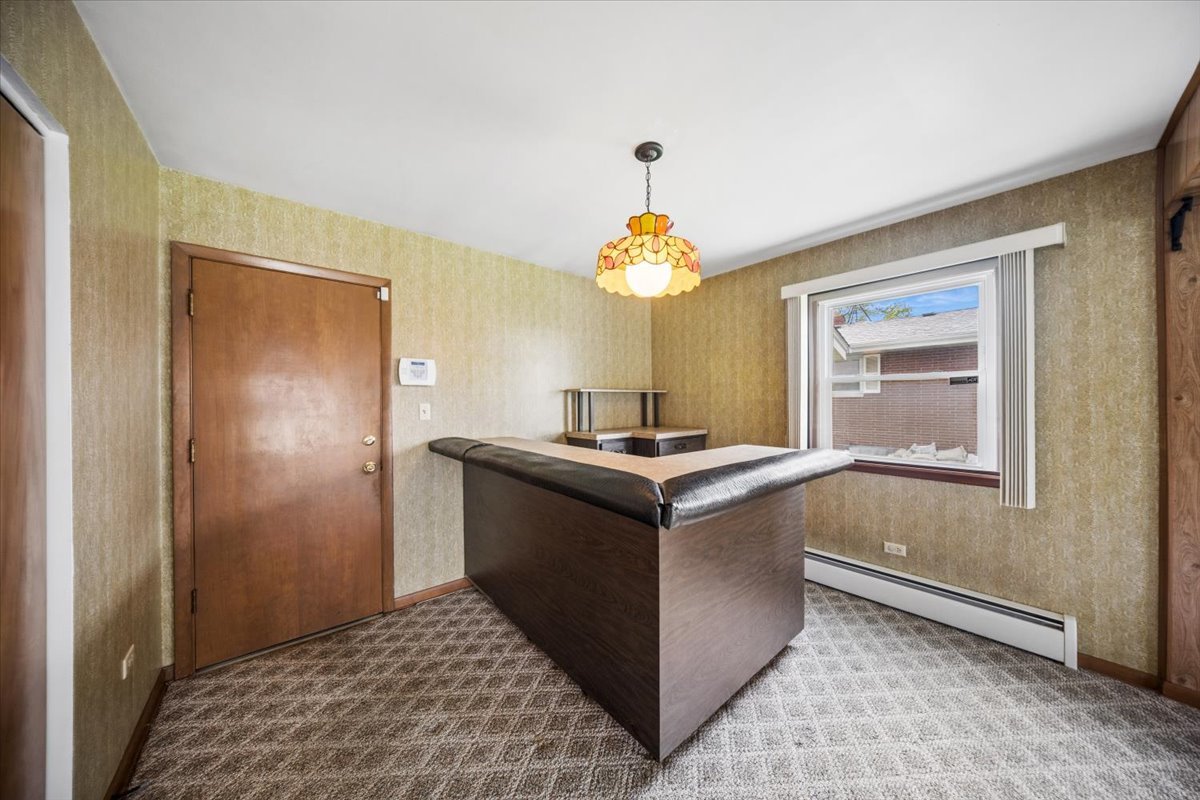 2316 185th Place Lansing, IL 60438 - Photo 16 of 21 a room with a chandelier and a table