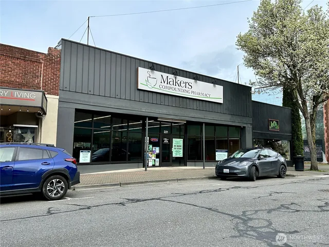 a view of a car parked in front of a building