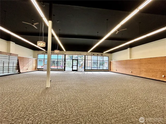 a view of an empty room with windows