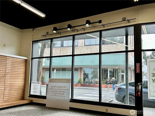 a view of an empty room with windows