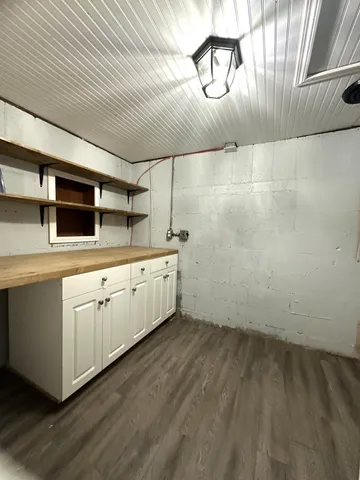 a kitchen with a sink and cabinets