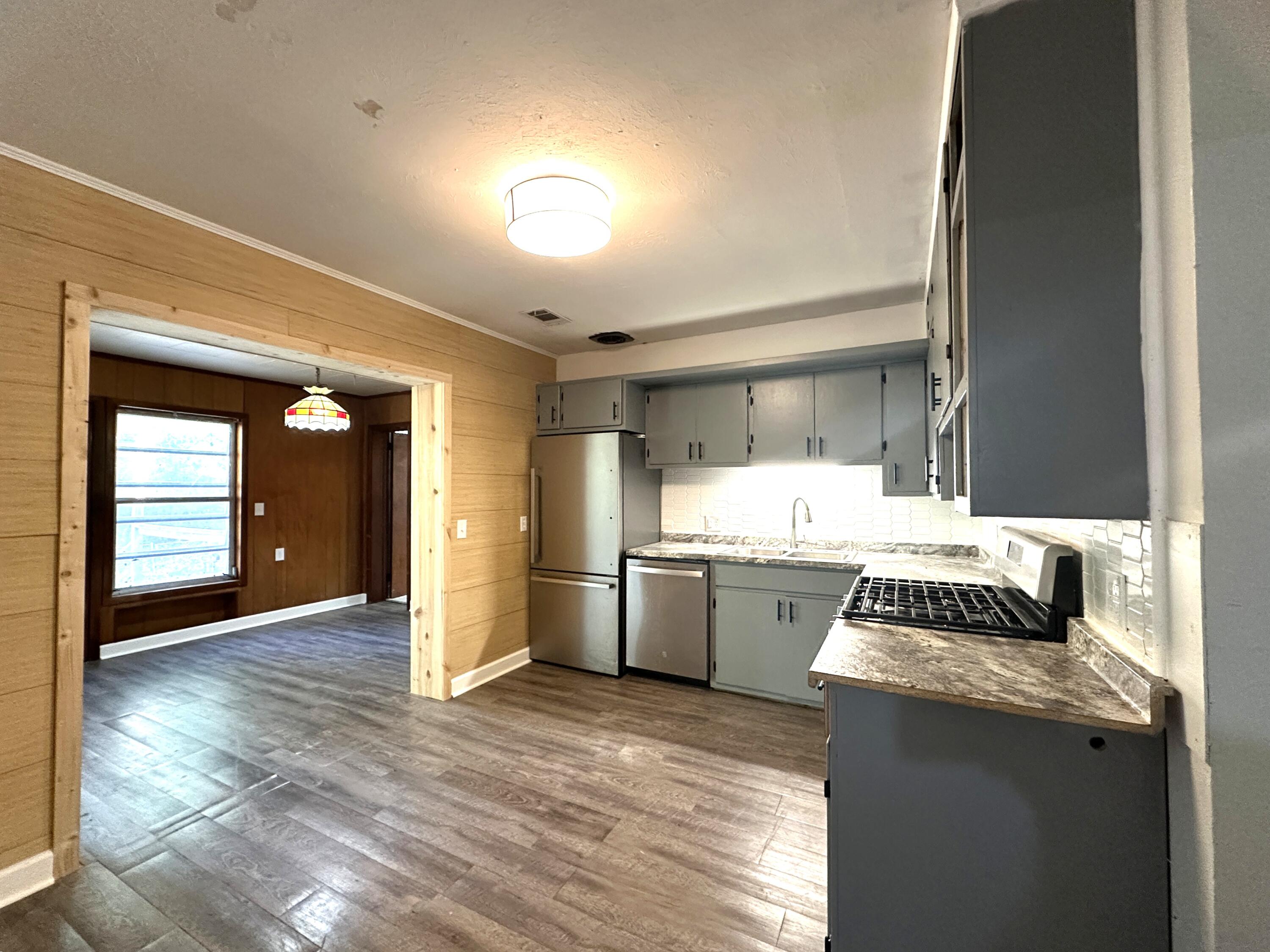 108 Sikes Drive Crestview, FL 32539 - Photo 9 of 41 a kitchen with a sink and stove