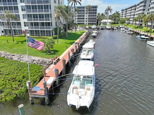 a backyard of a house with barbeque oven table and chairs