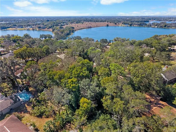 an aerial view of a city and lake view