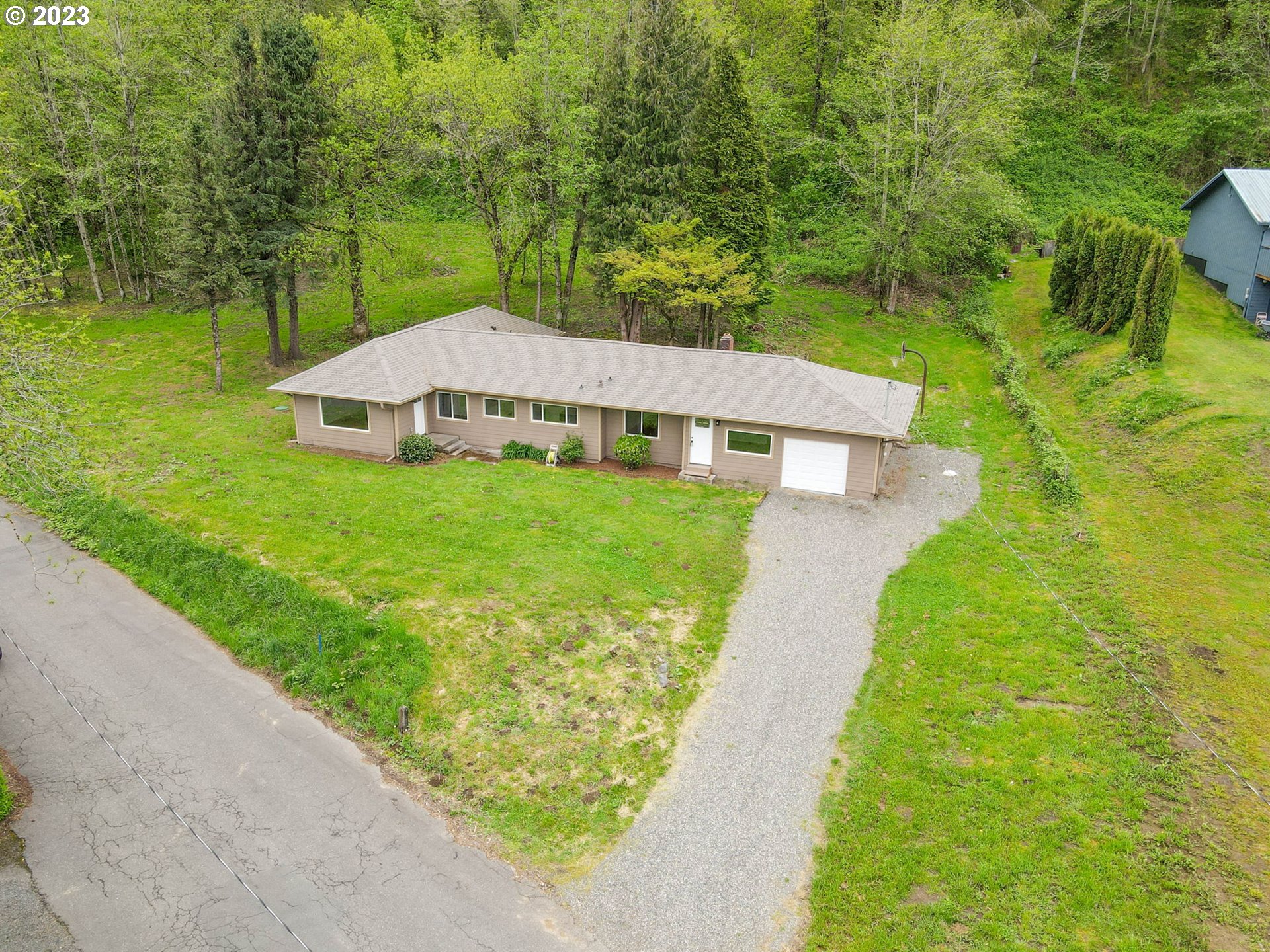 36810 Northeast Reed Road Corbett, OR 97019 - Photo 1 of 28 a view of a house with a yard