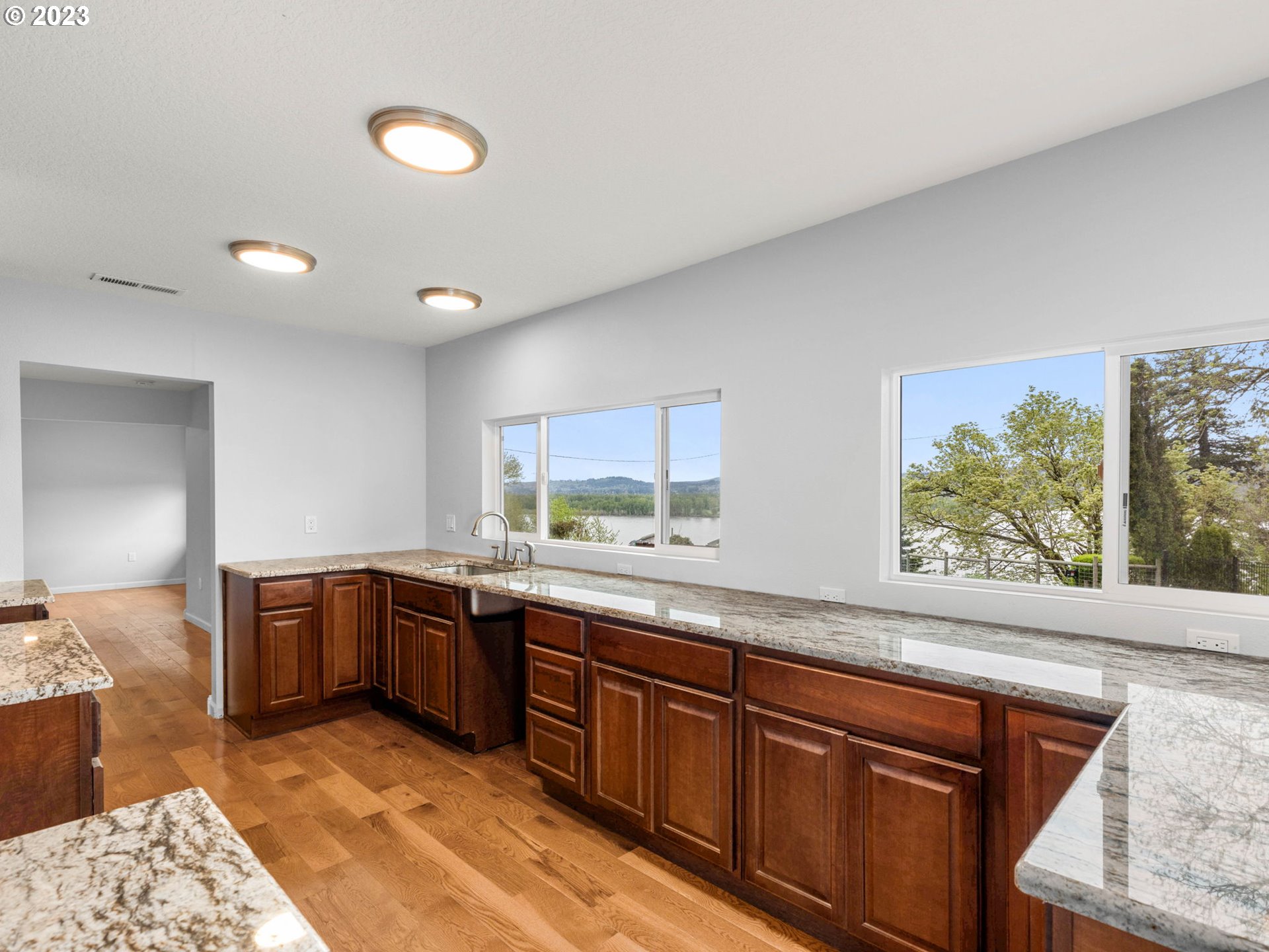 36810 Northeast Reed Road Corbett, OR 97019 - Photo 13 of 28 a large kitchen with stainless steel appliances granite countertop sink stove and cabinets