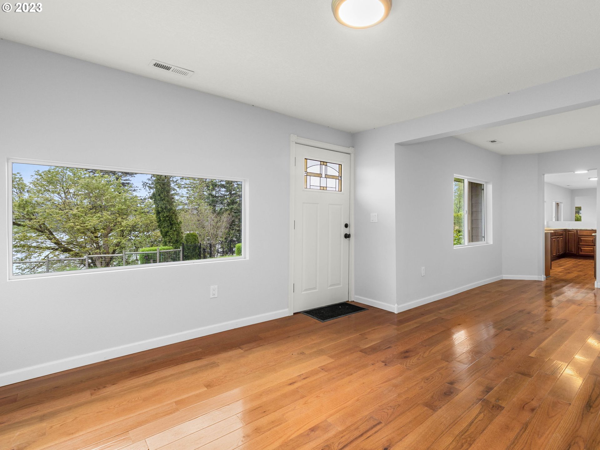 36810 Northeast Reed Road Corbett, OR 97019 - Photo 20 of 28 a view of empty room with wooden floor and fan