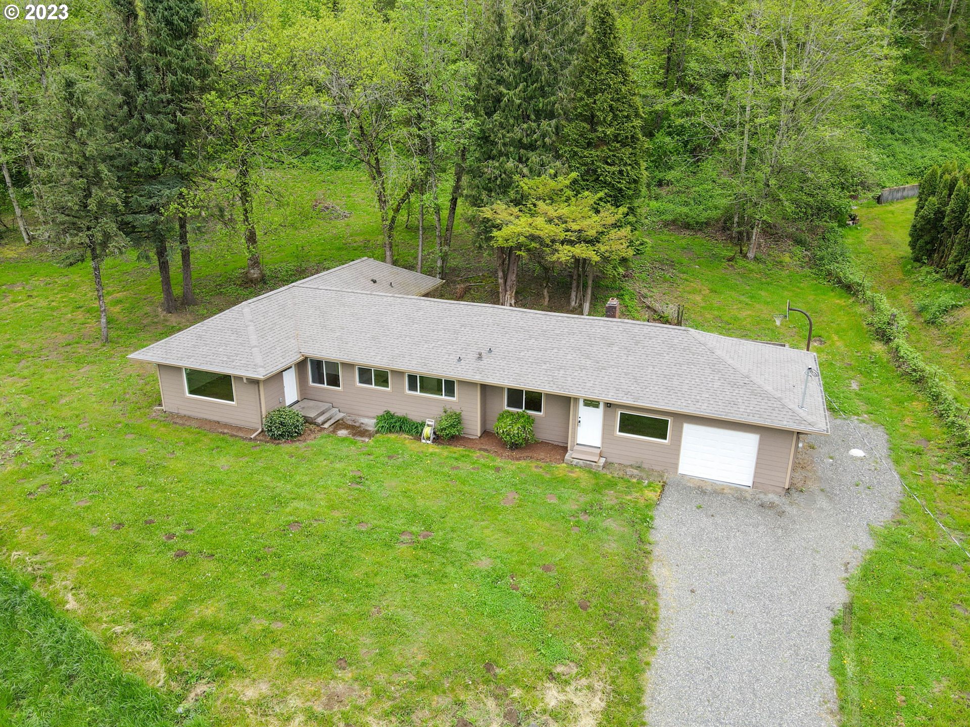 36810 Northeast Reed Road Corbett, OR 97019 - Photo 2 of 28 a aerial view of a house next to a big yard and large trees