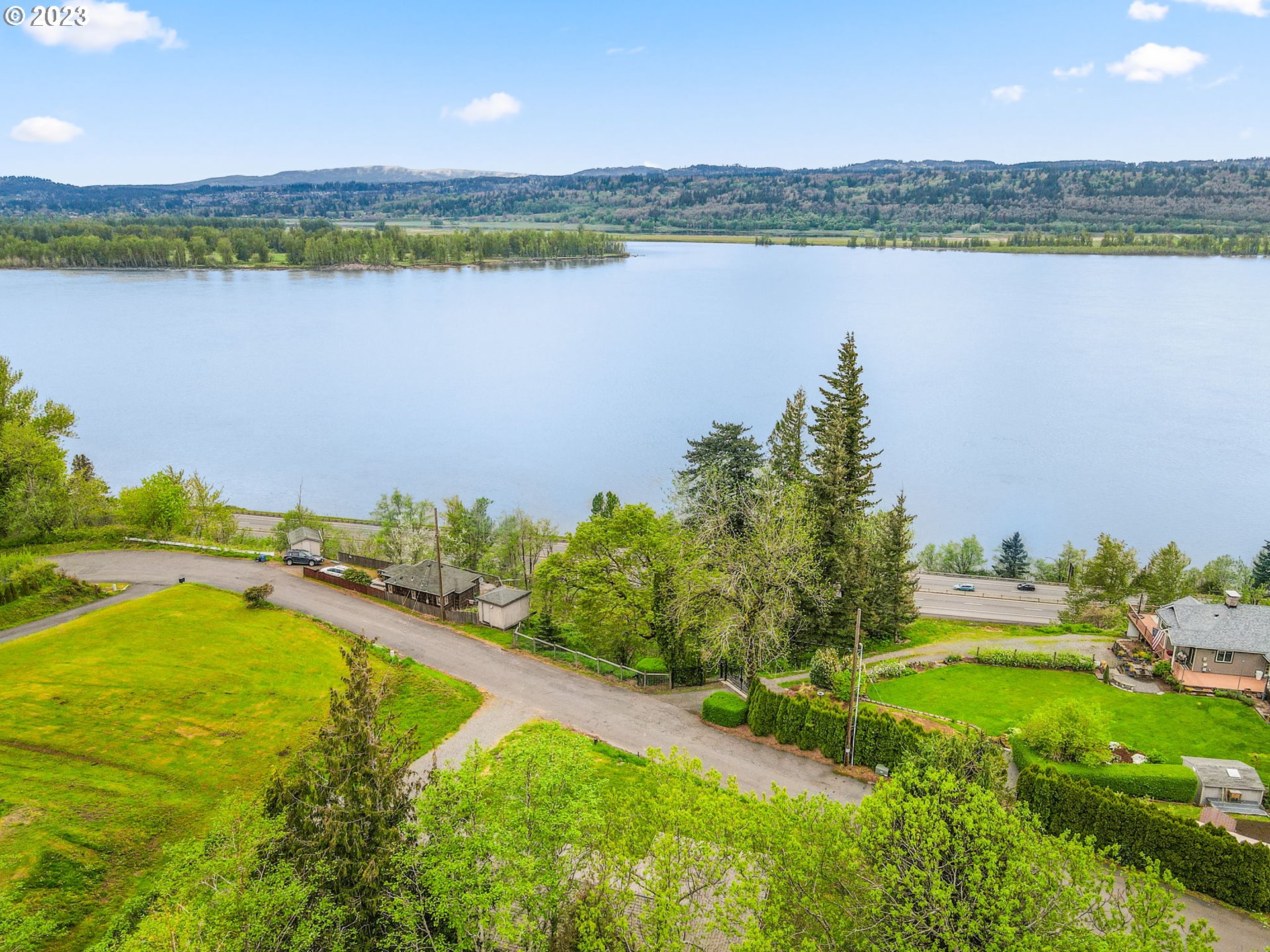 36810 Northeast Reed Road Corbett, OR 97019 - Photo 23 of 28 a view of a lake with a city