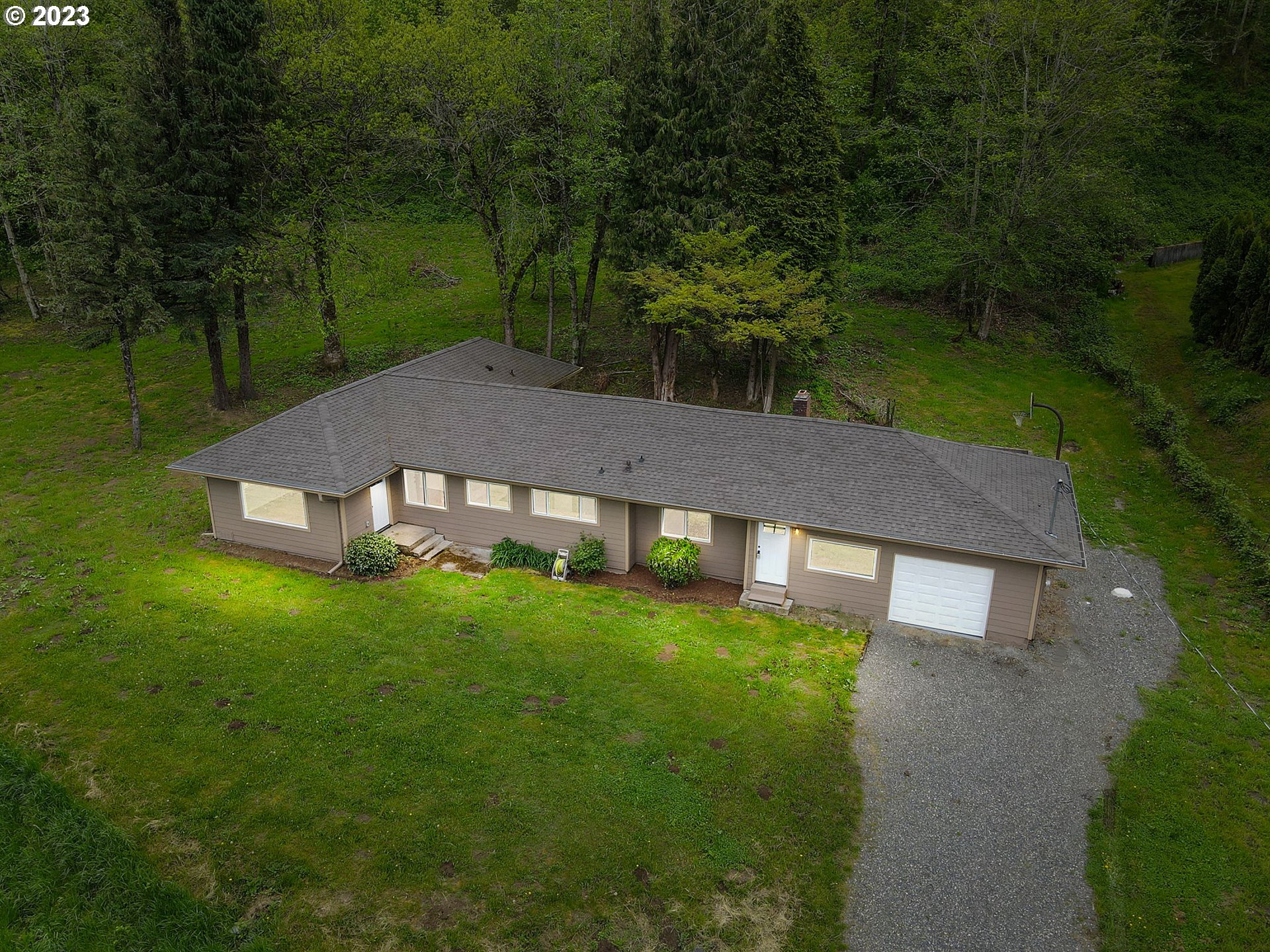 36810 Northeast Reed Road Corbett, OR 97019 - Photo 24 of 28 a view of a house with a yard
