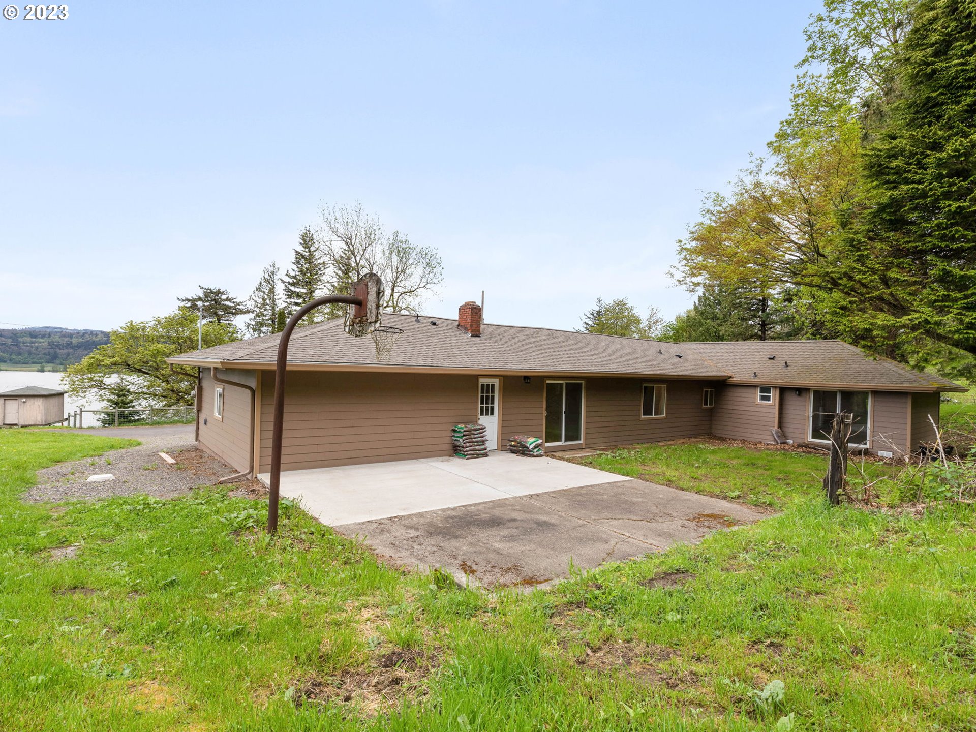36810 Northeast Reed Road Corbett, OR 97019 - Photo 26 of 28 a front view of a house with a garden and yard