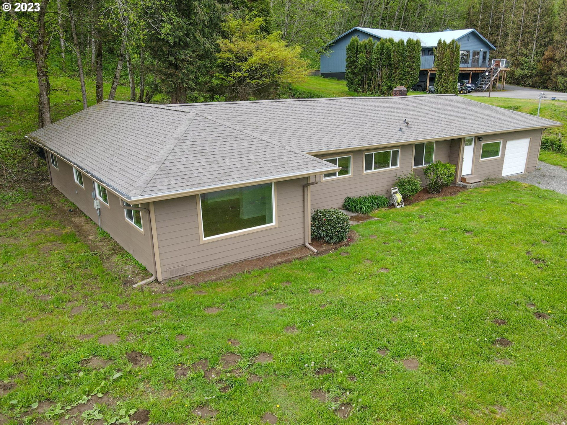 36810 Northeast Reed Road Corbett, OR 97019 - Photo 5 of 28 a aerial view of a house next to a big yard and large trees