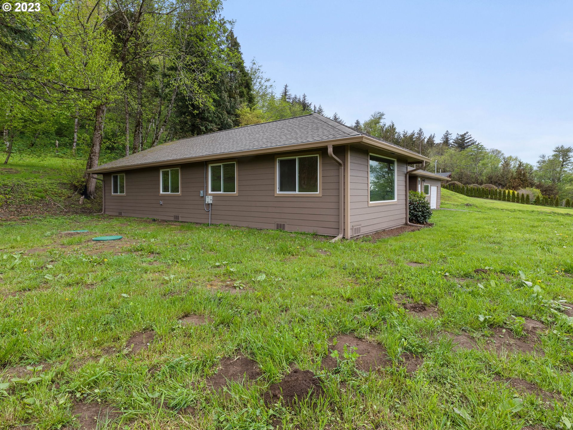 36810 Northeast Reed Road Corbett, OR 97019 - Photo 6 of 28 a house with a yard