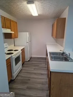 a kitchen with a stove and a microwave