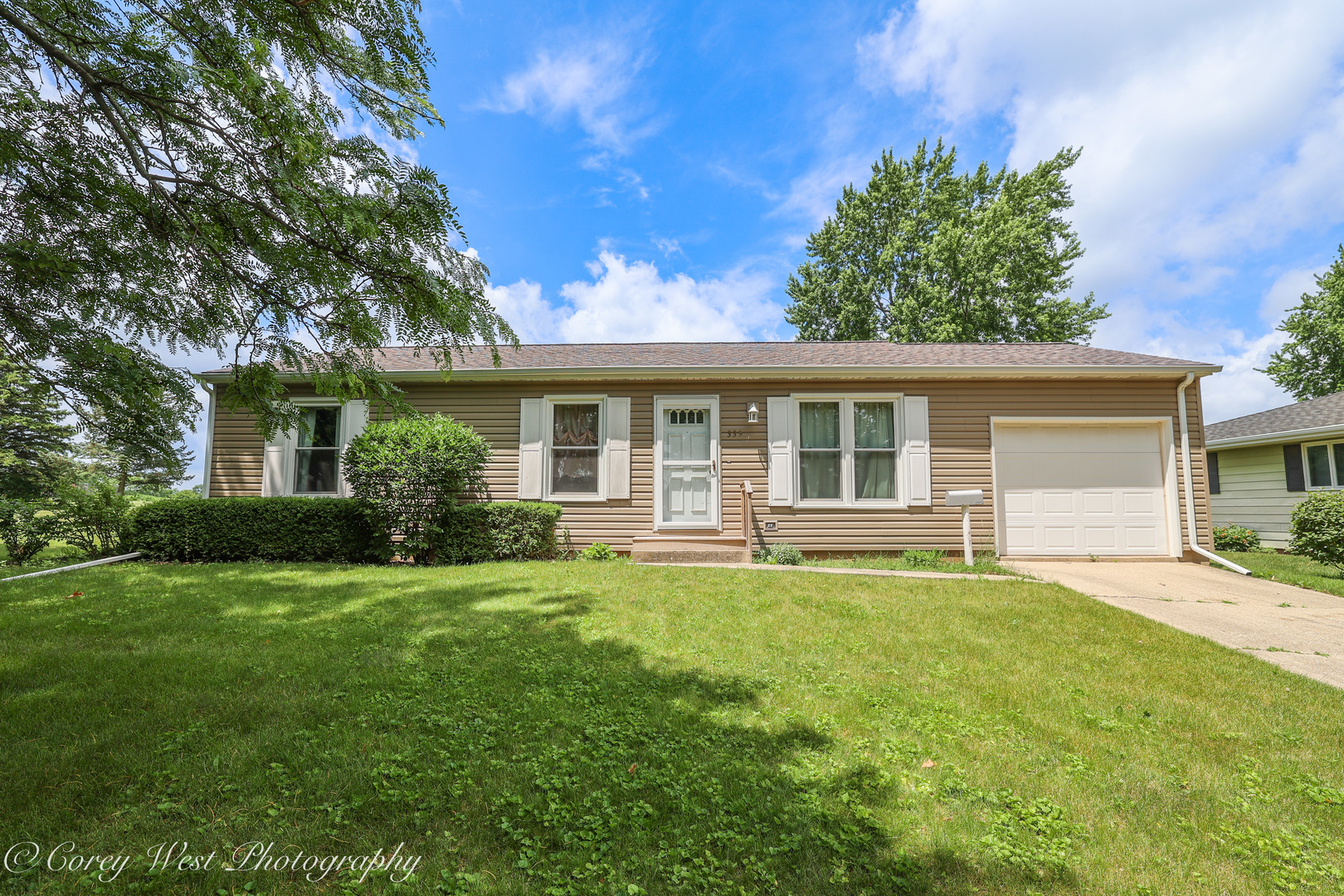335 South Hadsall Street Genoa, IL 60135 - Photo 1 of 23 a view of a house with a big yard and potted plants