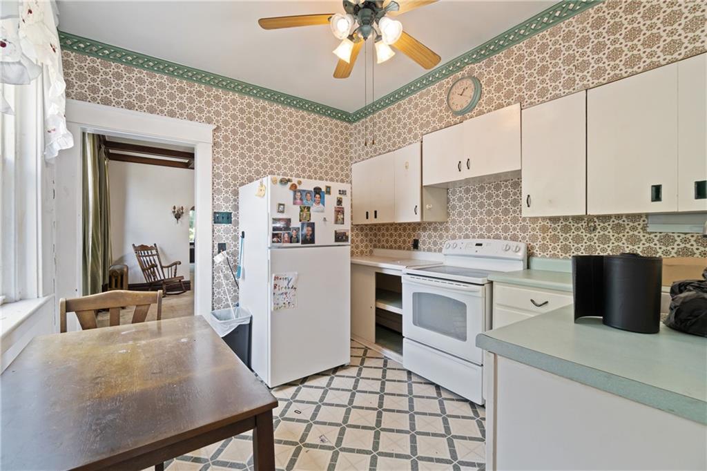 1300 Beechview Avenue Beechview, PA 15216 - Photo 11 of 31 a kitchen with a stove refrigerator and cabinets