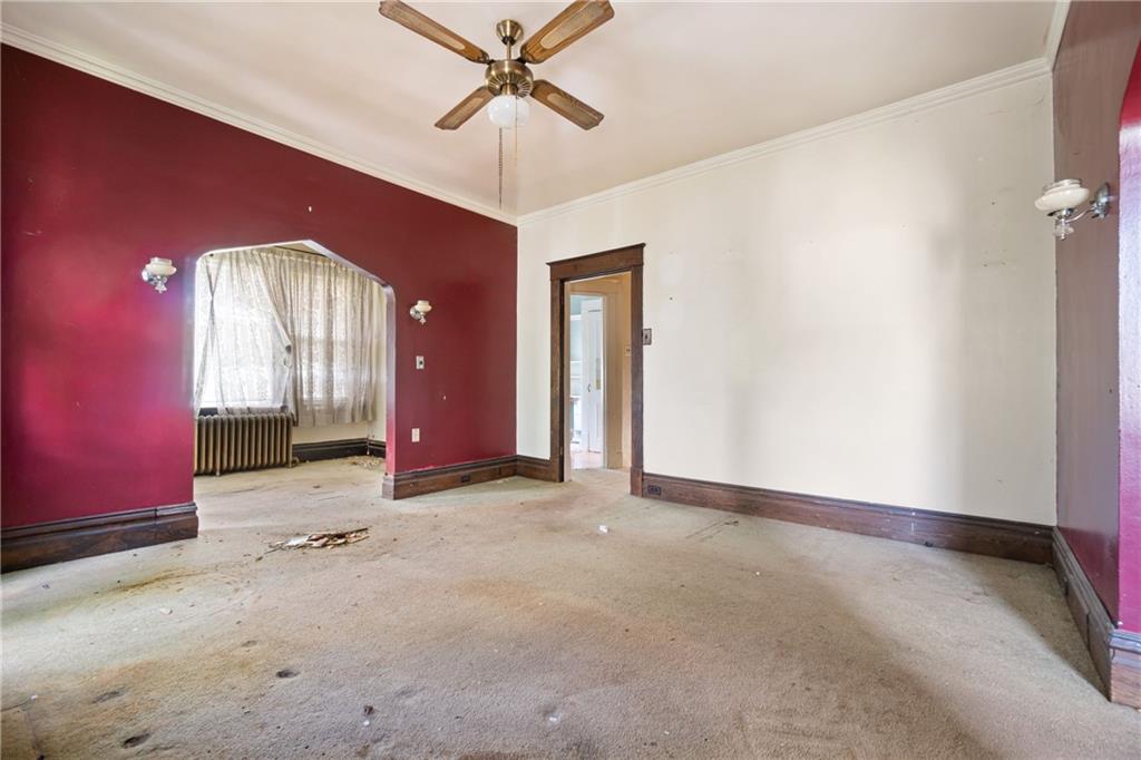 1300 Beechview Avenue Beechview, PA 15216 - Photo 17 of 31 an empty room with windows and fan