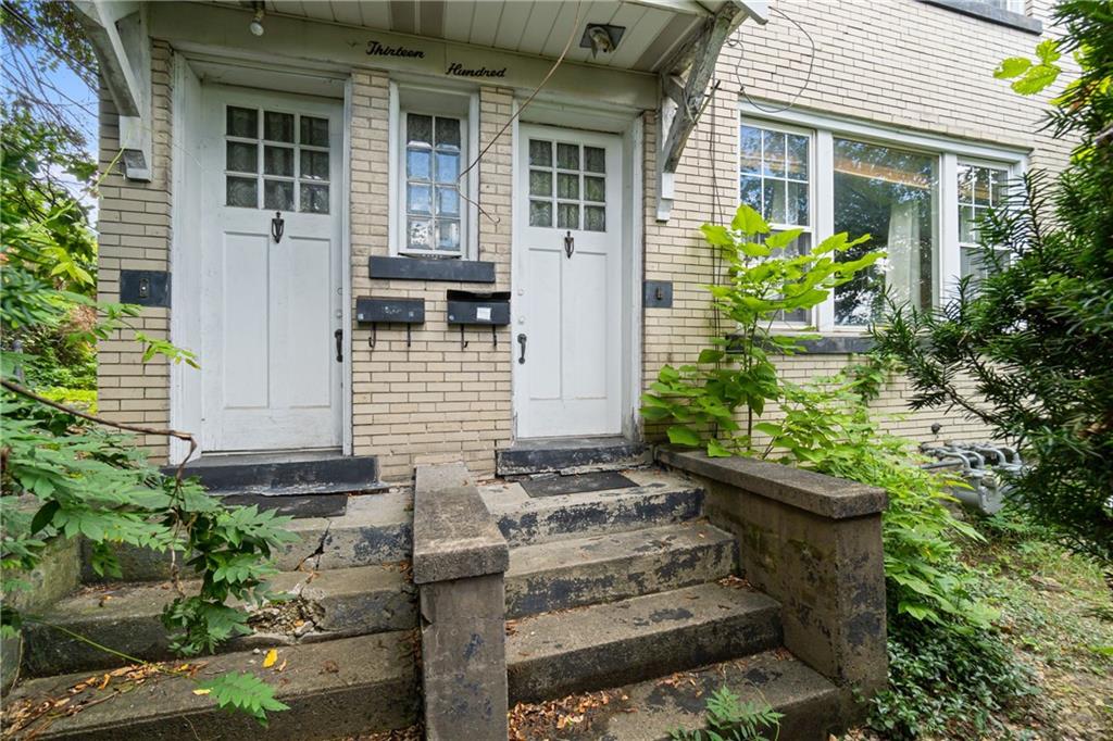 1300 Beechview Avenue Beechview, PA 15216 - Photo 2 of 31 front view of a house with potted plants
