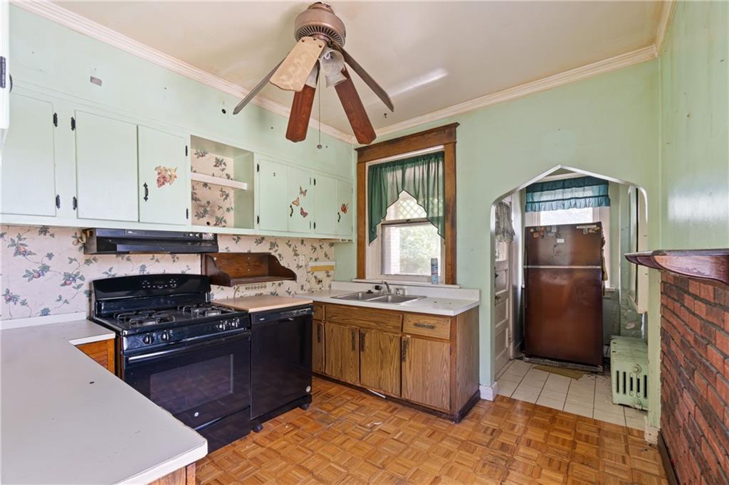 1300 Beechview Avenue Beechview, PA 15216 - Photo 21 of 31 a kitchen with a stove a refrigerator and cabinets